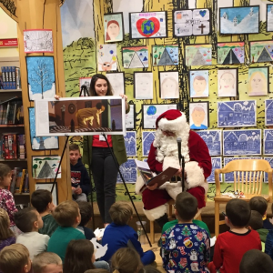 Everyone enjoyed Santa reading the Night Before Christmas.