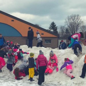 Climbing on snow banks was a part of Winter Fun Day for grades 1 to 4.